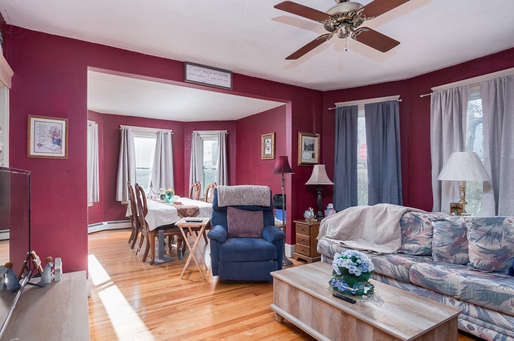 63 Pilgrim Avenue Worcester, MA 01604 - Photo 15 of 23 a living room with furniture and a chandelier