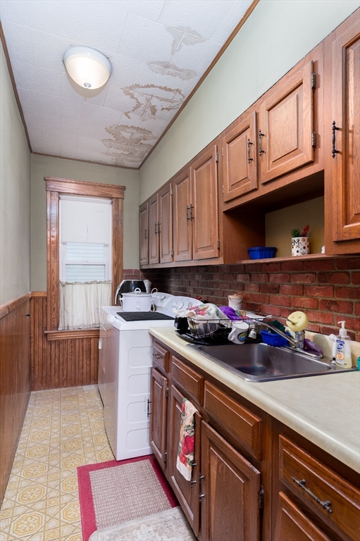 63 Pilgrim Avenue Worcester, MA 01604 - Photo 20 of 23 a kitchen with stainless steel appliances granite countertop a stove a sink and cabinets