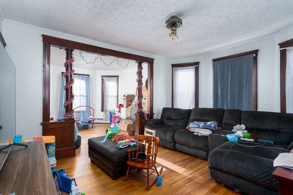 63 Pilgrim Avenue Worcester, MA 01604 - Photo 10 of 23 a living room with furniture and a large window