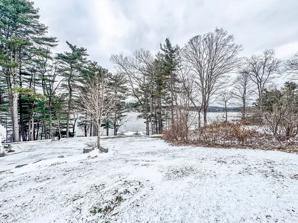 a view of snow covered with snow in front of house