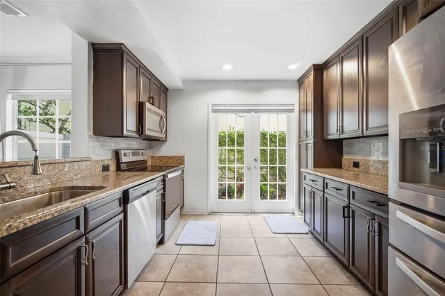 a bedroom with a bed closet and flat screen tv