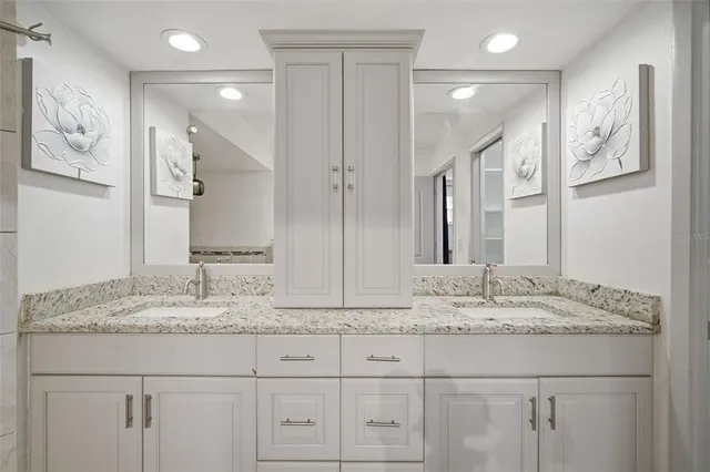 a view of water heater room with wooden floor