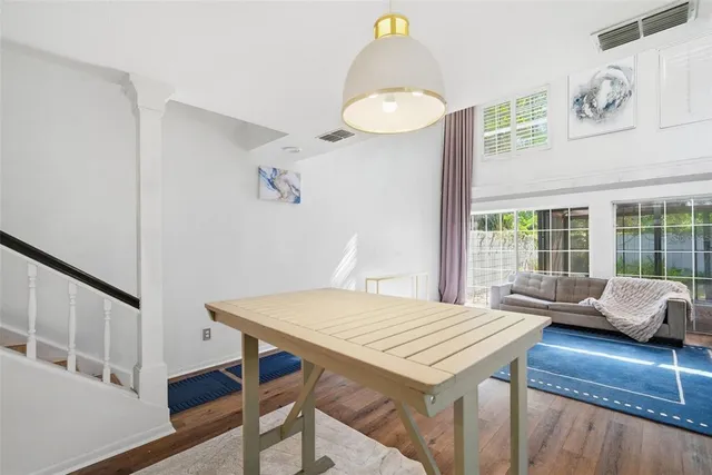 a kitchen with stainless steel appliances granite countertop a sink refrigerator and cabinets