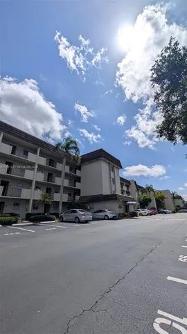 a view of a house with a snow in the yard