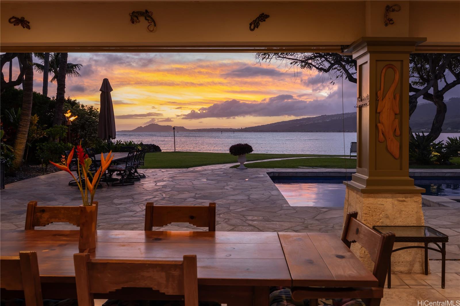 a view of swimming pool with sitting area