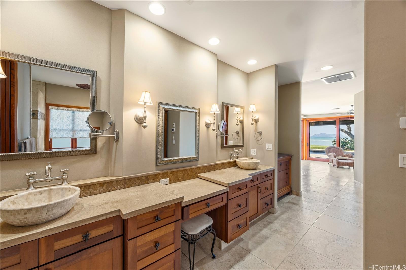 365 Portlock Road Honolulu, HI 96825 - Photo 13 of 25 a spacious bathroom with a granite countertop sink mirror and shower