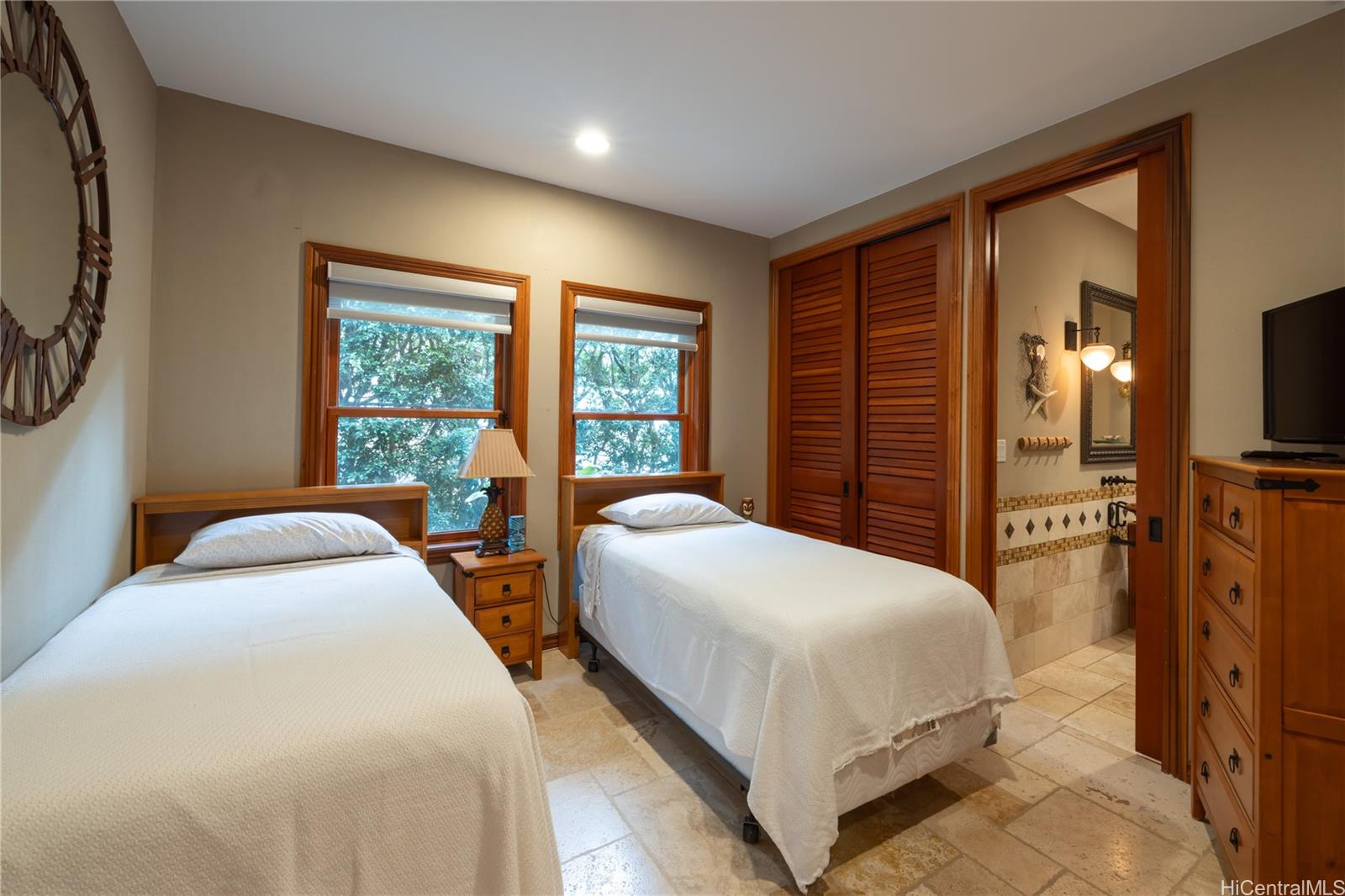365 Portlock Road Honolulu, HI 96825 - Photo 14 of 25 a bedroom with bed and large windows