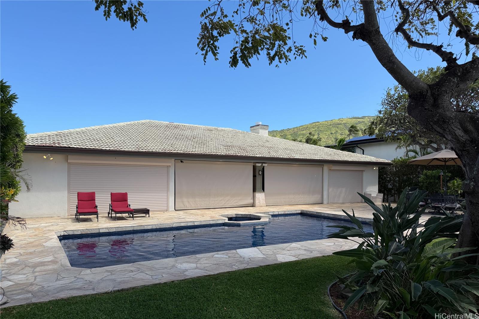 365 Portlock Road Honolulu, HI 96825 - Photo 21 of 25 a front view of a house with a yard