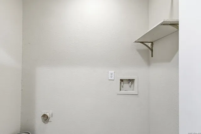 a view of a room with rack on the wall