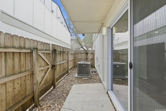 a view of staircase with wooden floor and white walls
