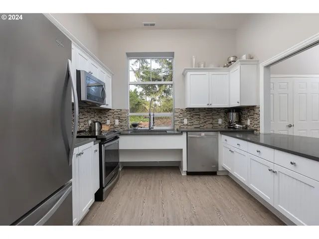 a room with lots of pool table and windows
