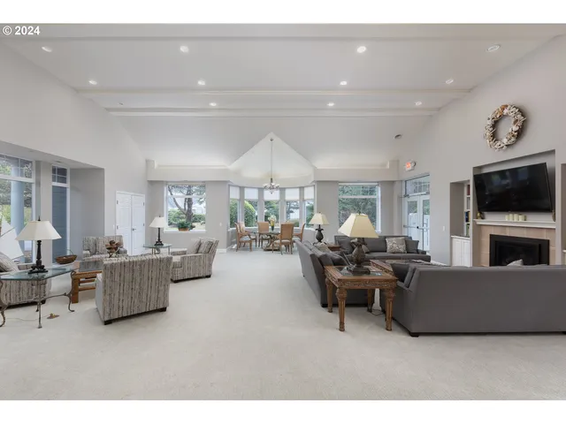a dining room with furniture a chandelier and a rug
