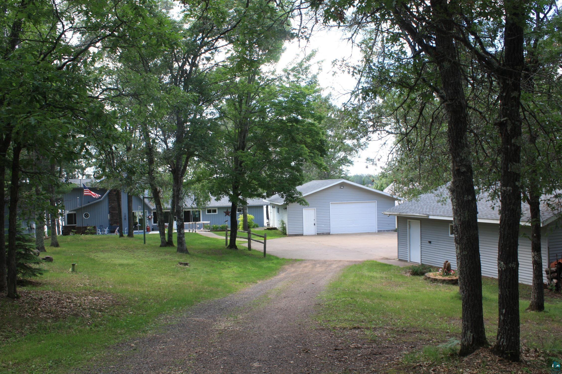 16025 South Mail Road Gordon, WI 54838 - Photo 1 of 50 Exterior space with a front yard and a garage