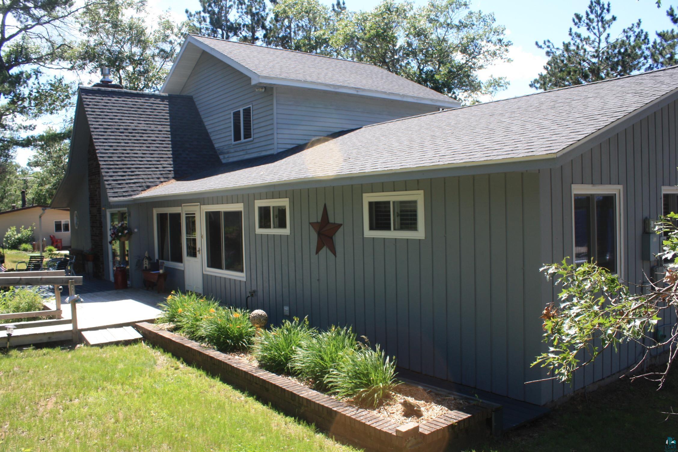 16025 South Mail Road Gordon, WI 54838 - Photo 3 of 50 View of home's exterior with a wooden deck