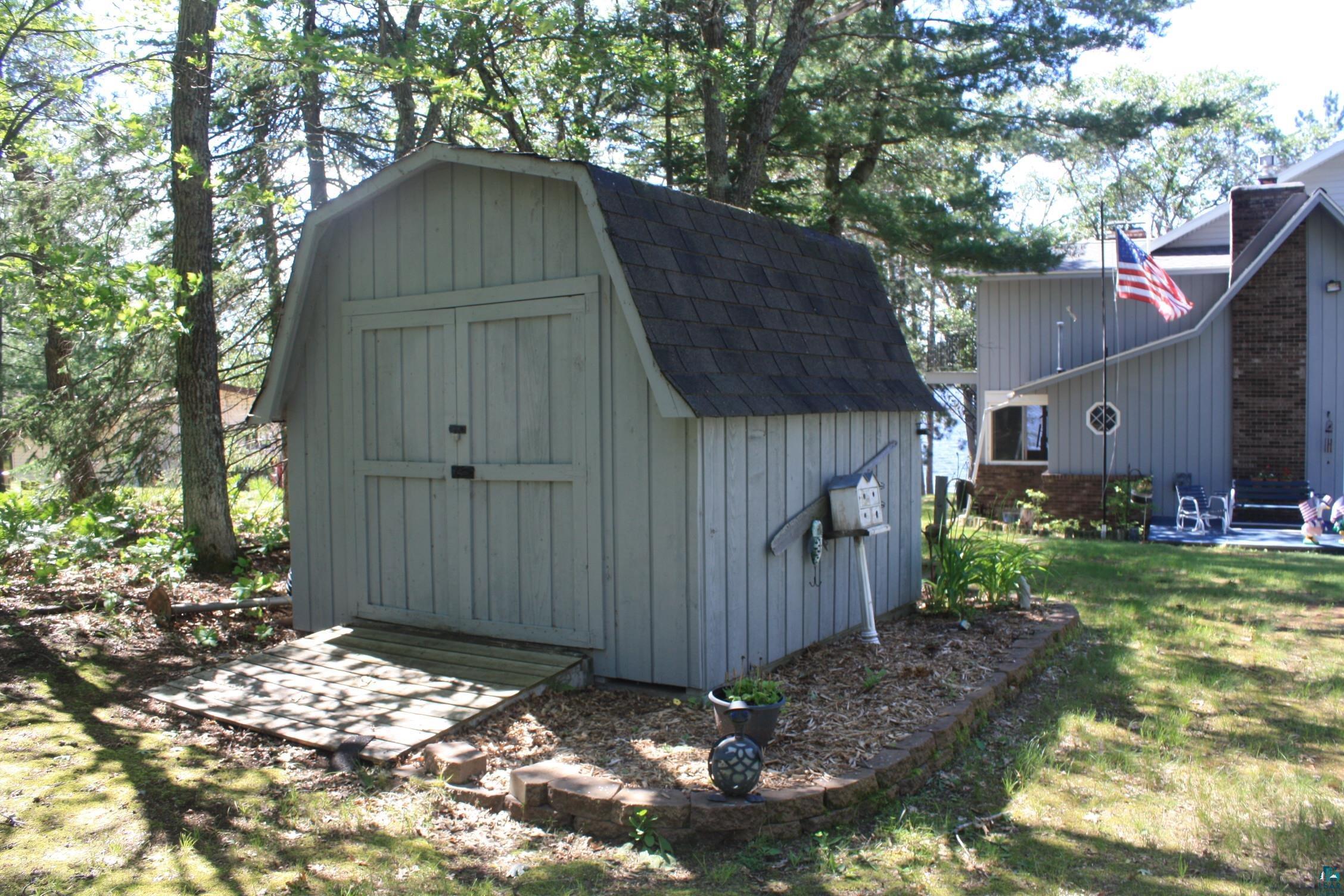16025 South Mail Road Gordon, WI 54838 - Photo 8 of 50 View of shed / structure with a lawn