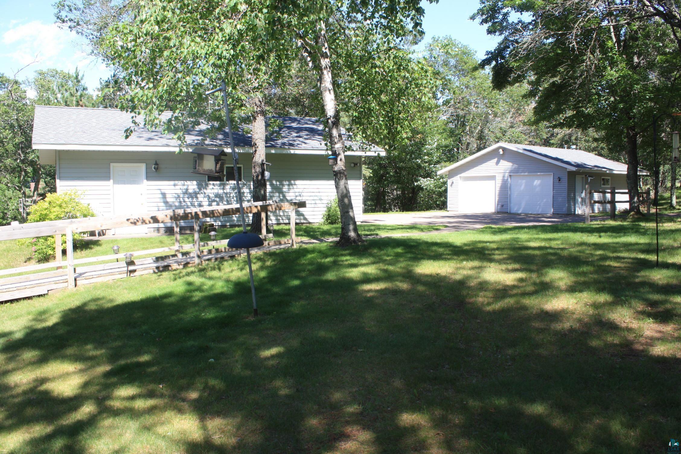 16025 South Mail Road Gordon, WI 54838 - Photo 9 of 50 View of yard featuring a garage and an outdoor structure