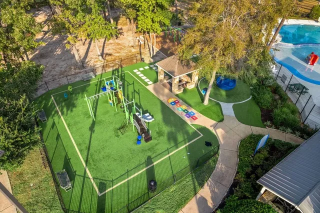 an outdoor view of a house with backyard