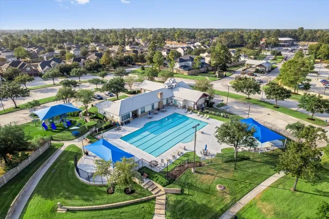 an aerial view of a house with yard swimming pool and outdoor seating