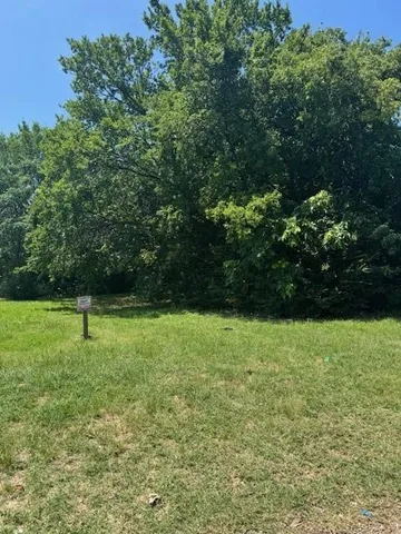 a view of outdoor space with deck and yard