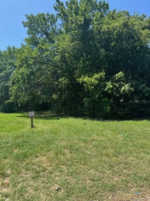 a view of outdoor space with deck and yard