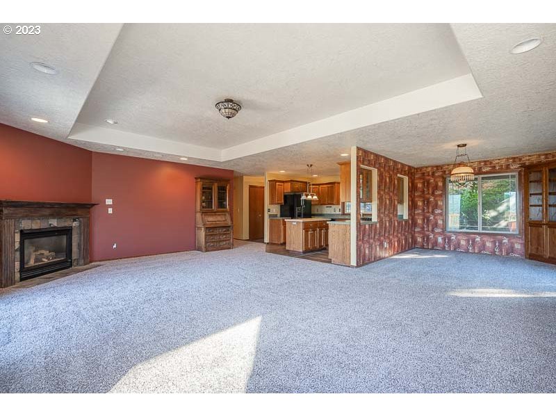 6295 Kings Ridge Road Dallas, OR 97338 - Photo 11 of 44 a living room with furniture and a fireplace