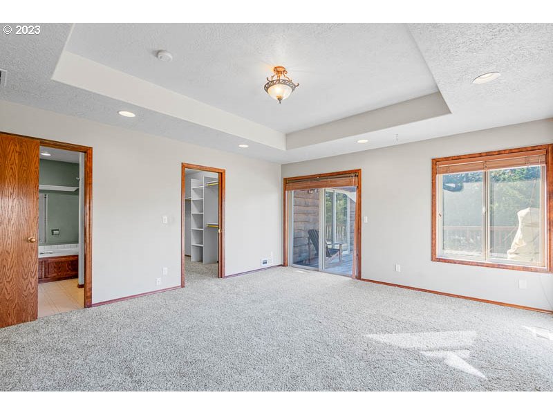 6295 Kings Ridge Road Dallas, OR 97338 - Photo 17 of 44 a view of an empty room with a window