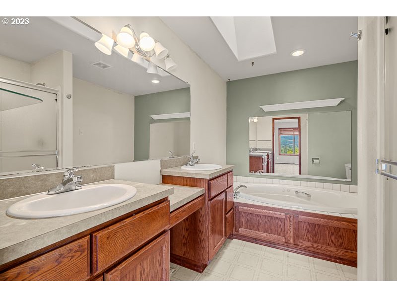 6295 Kings Ridge Road Dallas, OR 97338 - Photo 20 of 44 a bathroom with a sink double vanity granite and a mirror