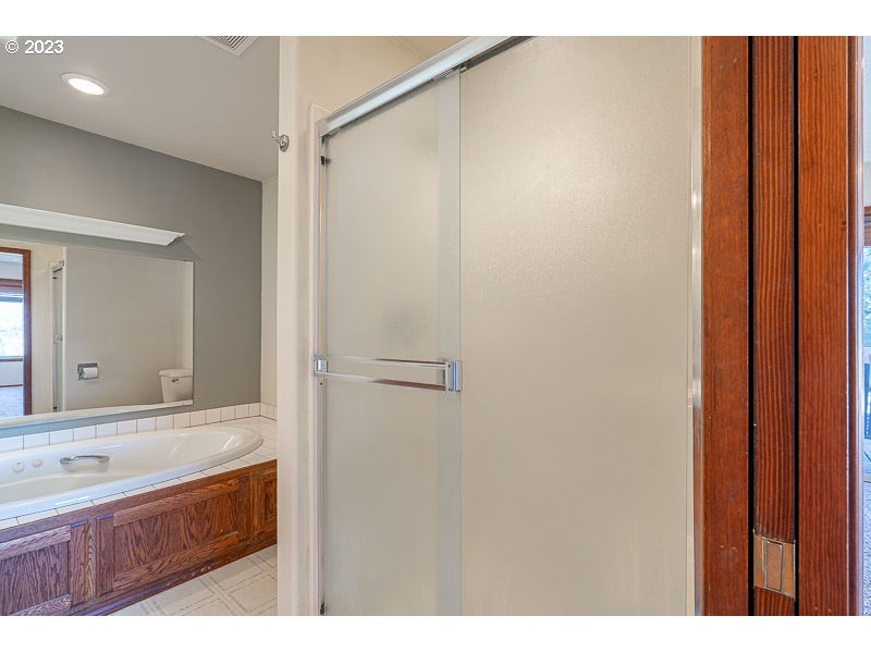 6295 Kings Ridge Road Dallas, OR 97338 - Photo 21 of 44 a bathroom with a sink and a mirror