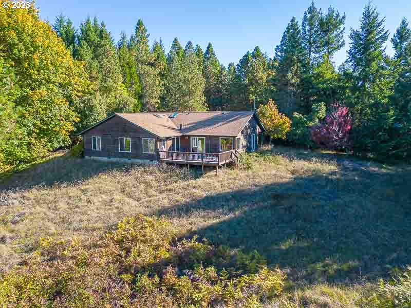 6295 Kings Ridge Road Dallas, OR 97338 - Photo 3 of 44 a view of a house with a yard and sitting area