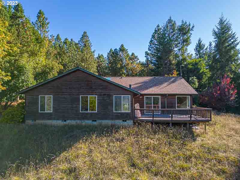 6295 Kings Ridge Road Dallas, OR 97338 - Photo 35 of 44 a front view of a house with garden