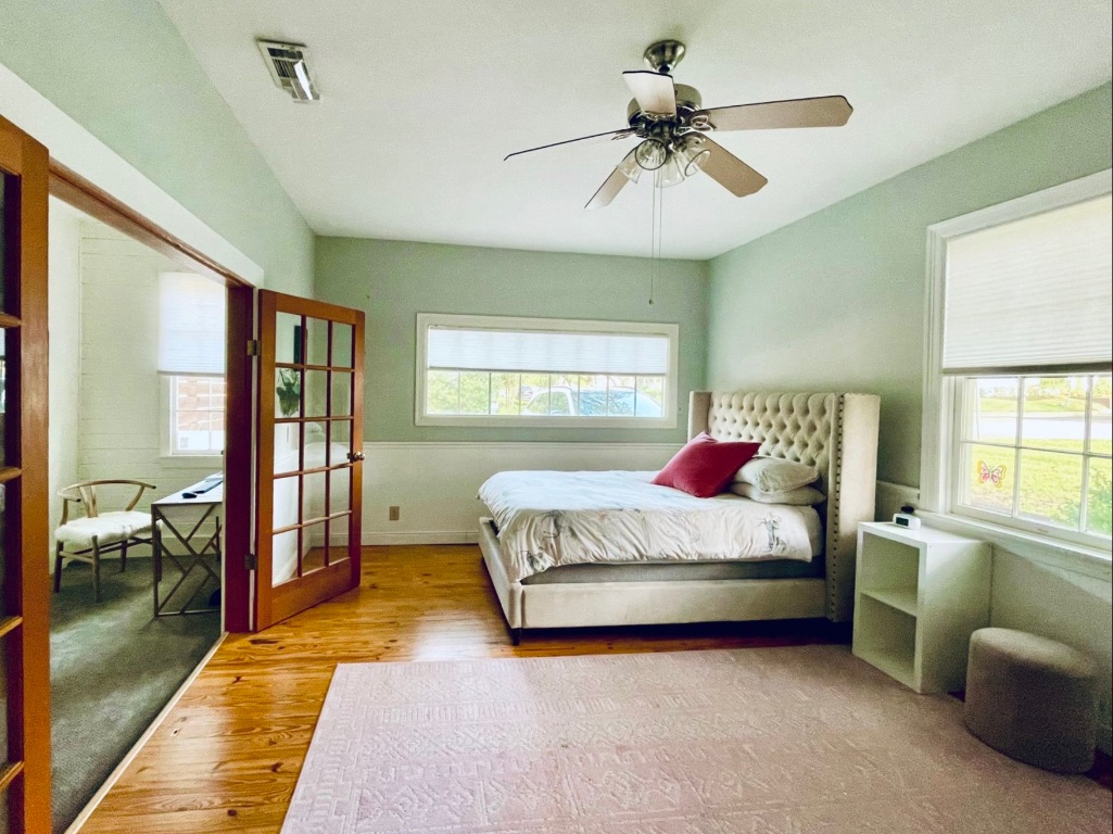 3321 Windsor Road Austin, TX 78703 - Photo 14 of 28 a spacious bedroom with a bed and a couch