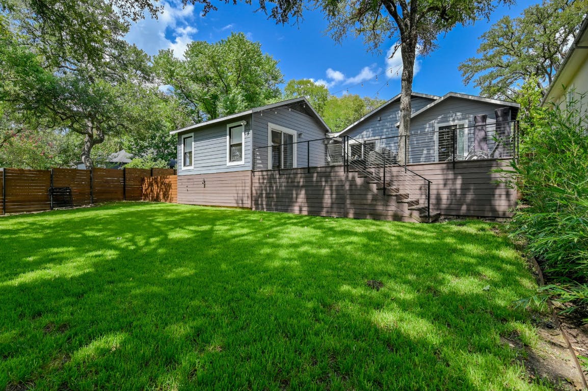 3321 Windsor Road Austin, TX 78703 - Photo 19 of 28 a view of a house with a yard and a large tree