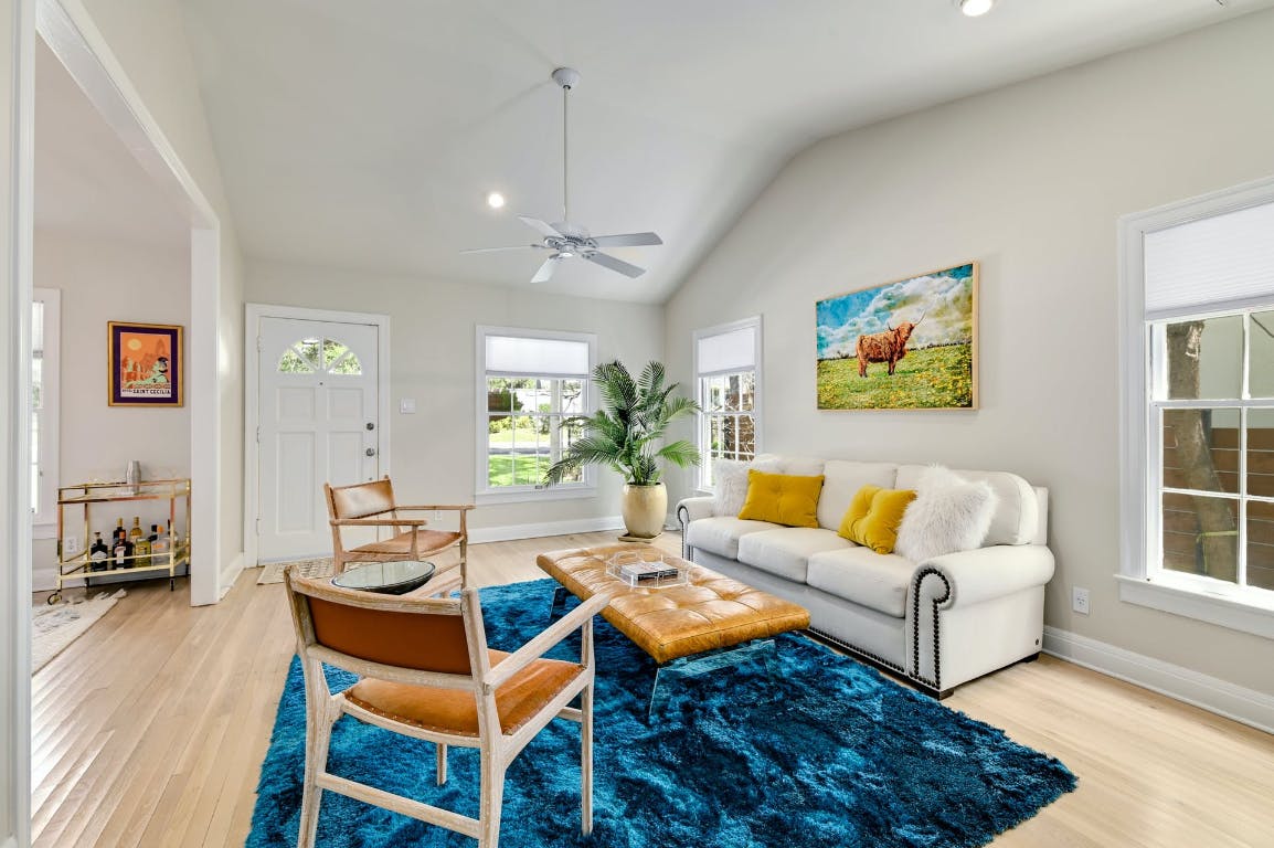 3321 Windsor Road Austin, TX 78703 - Photo 23 of 28 a living room with furniture a wooden floor and next to a window