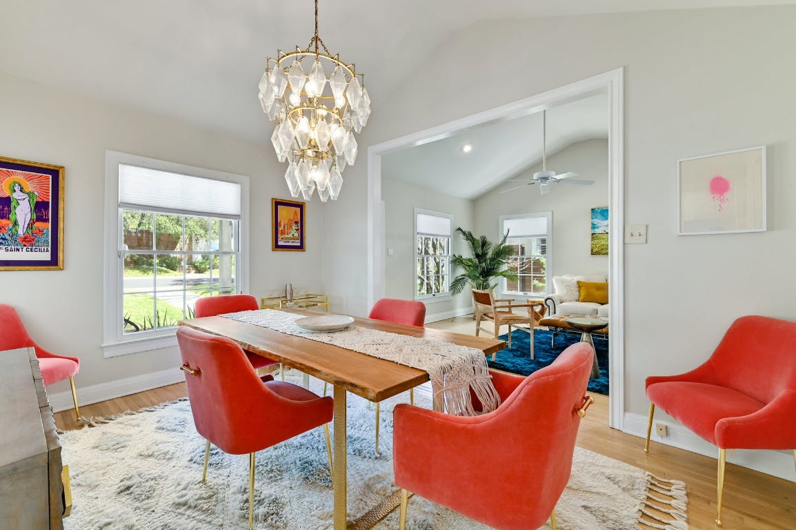 3321 Windsor Road Austin, TX 78703 - Photo 3 of 28 a dining room with furniture a chandelier and wooden floor