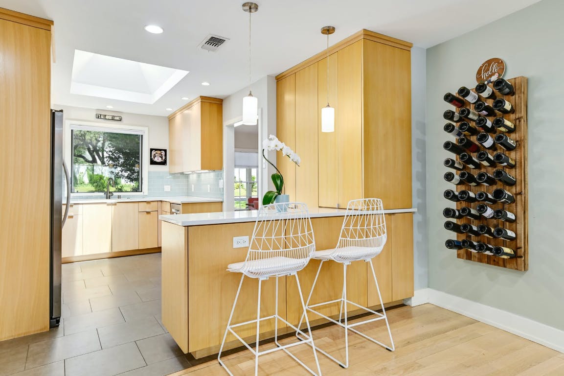 3321 Windsor Road Austin, TX 78703 - Photo 4 of 28 a kitchen with granite countertop a table and chairs in it