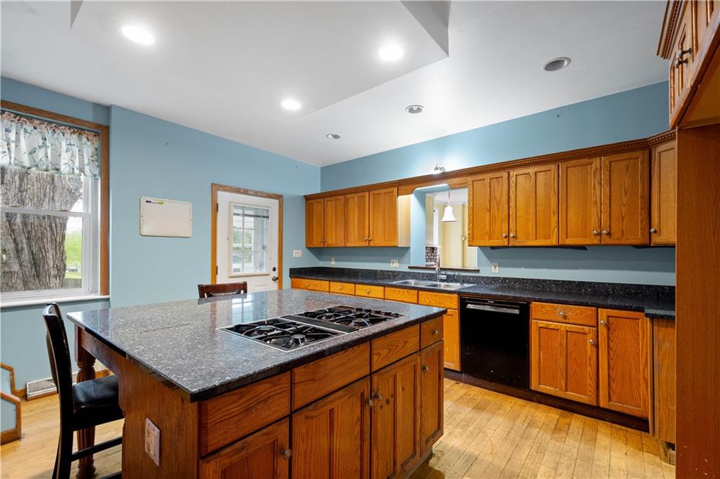 36 Little Mingo Road Finleyville, PA 15332 - Photo 11 of 50 a kitchen with stainless steel appliances granite countertop a stove a sink dishwasher and cabinets with wooden floor