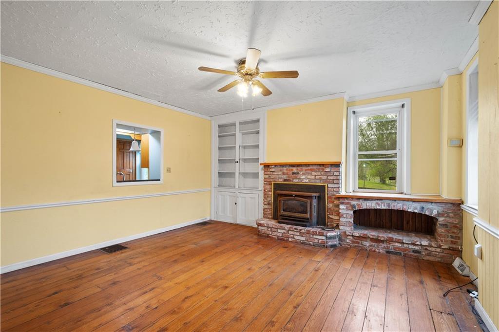 36 Little Mingo Road Finleyville, PA 15332 - Photo 20 of 50 wooden floor fireplace and windows in an empty room