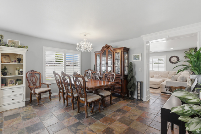 1652 West 800 South Lehi, UT 84043 - Photo 7 of 27 Dining space featuring hanging lights, healthy amount of natural light, and stone tile flooring