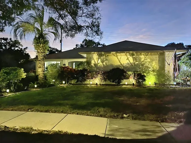 a backyard of a house with lots of green space