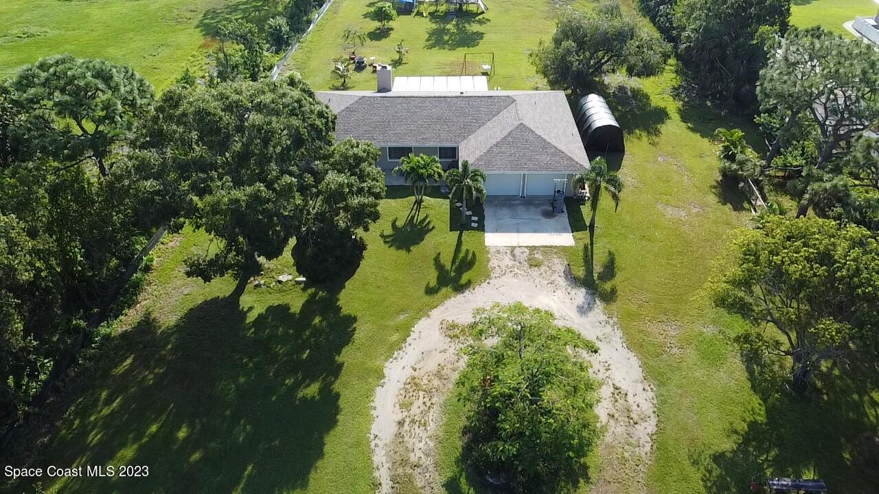 2745 Corey Road Malabar, FL 32950 - Photo 24 of 39 a view of house with garden