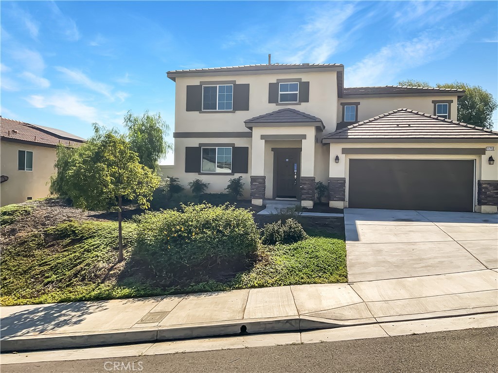 11756 Connell Road Riverside, CA 92505 - Photo 1 of 1 a front view of a house with a garden