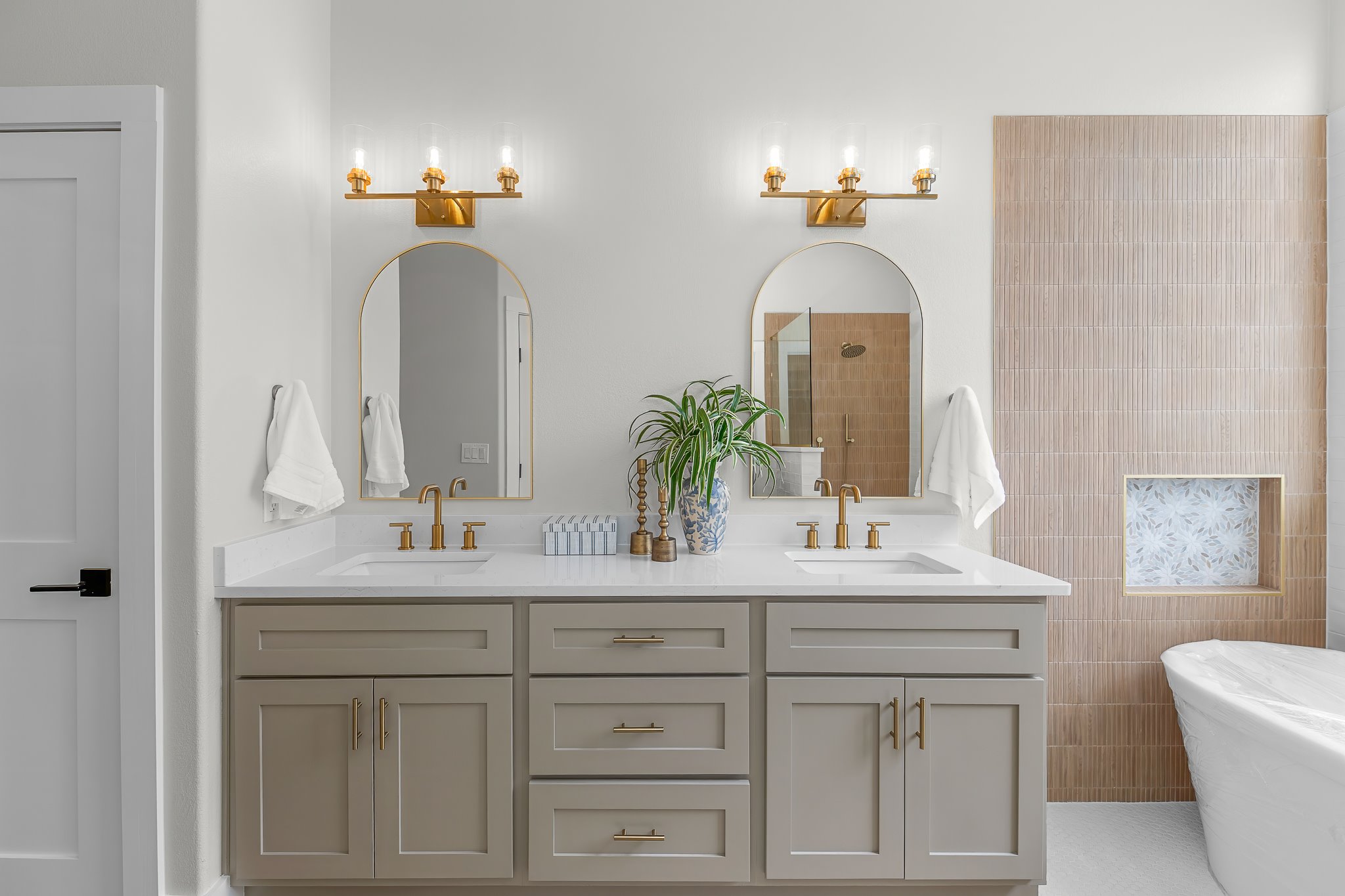 130 Crepe Myrtle Lane Georgetown, TX 78633 - Photo 25 of 40 Double vanity in primary bath, with standing soaker tub visible to right
