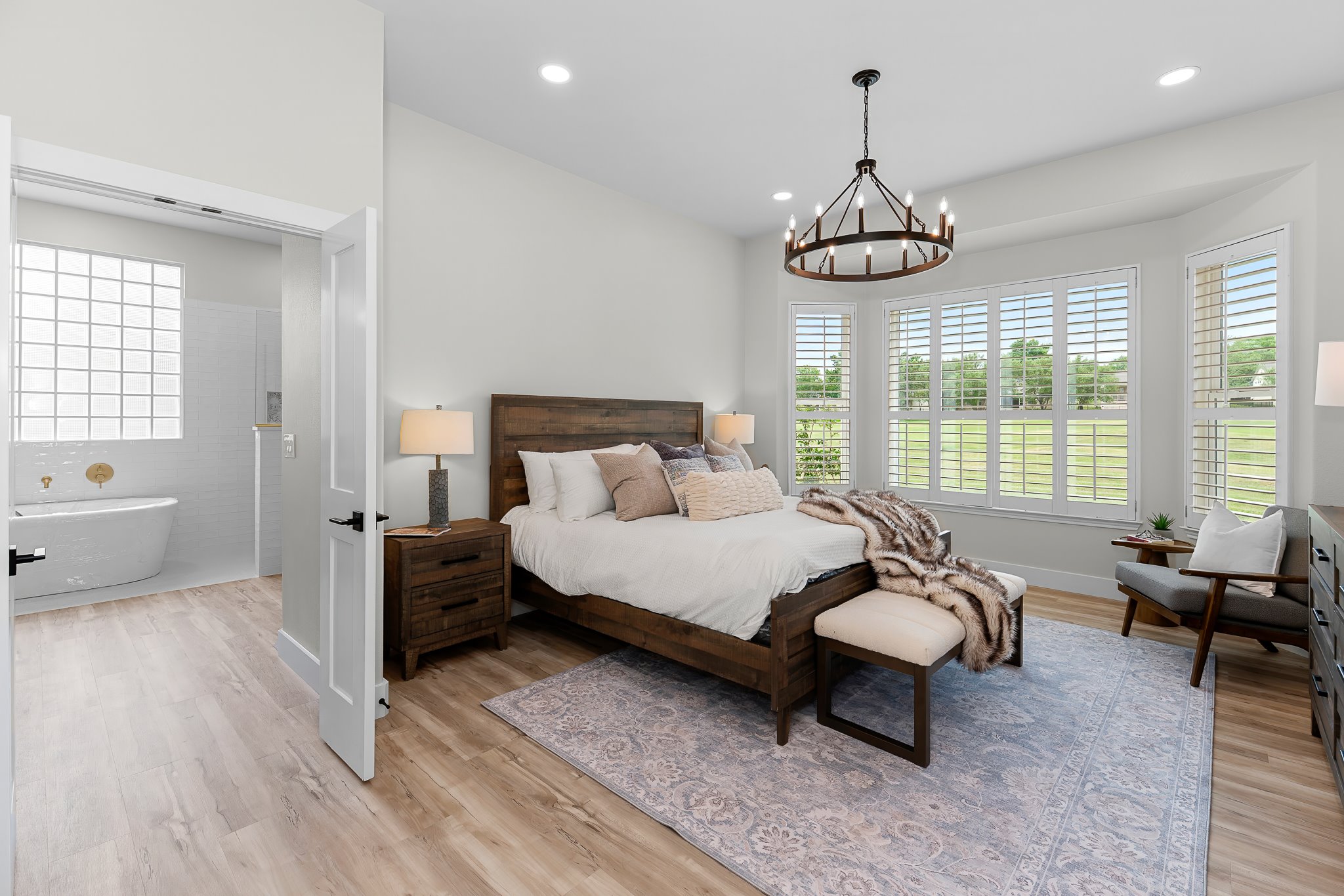 130 Crepe Myrtle Lane Georgetown, TX 78633 - Photo 3 of 40 The primary bedroom features bay windows with plantation shutters to take advantage of the golf course view