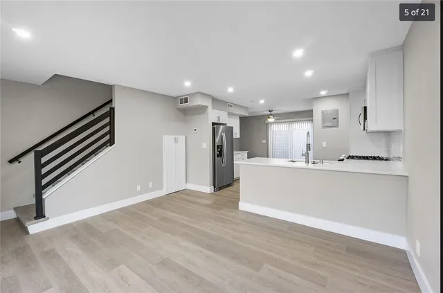 a view of kitchen with wooden floor
