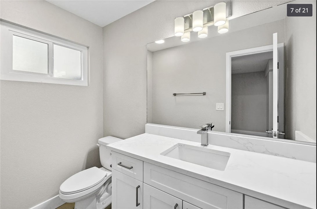 1024 Mission Drive, Unit B Costa Mesa, CA 92626 - Photo 8 of 15 a bathroom with a sink a toilet and a mirror