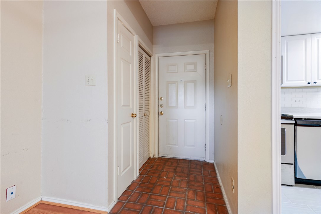 706 West 22nd Street, Unit 202 Austin, TX 78705 - Photo 17 of 24 a view of a hallway with a wooden floor