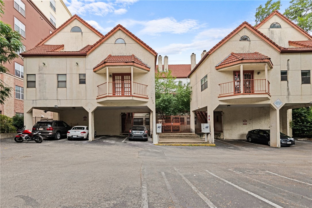 706 West 22nd Street, Unit 202 Austin, TX 78705 - Photo 2 of 24 a view of a car park in front of house