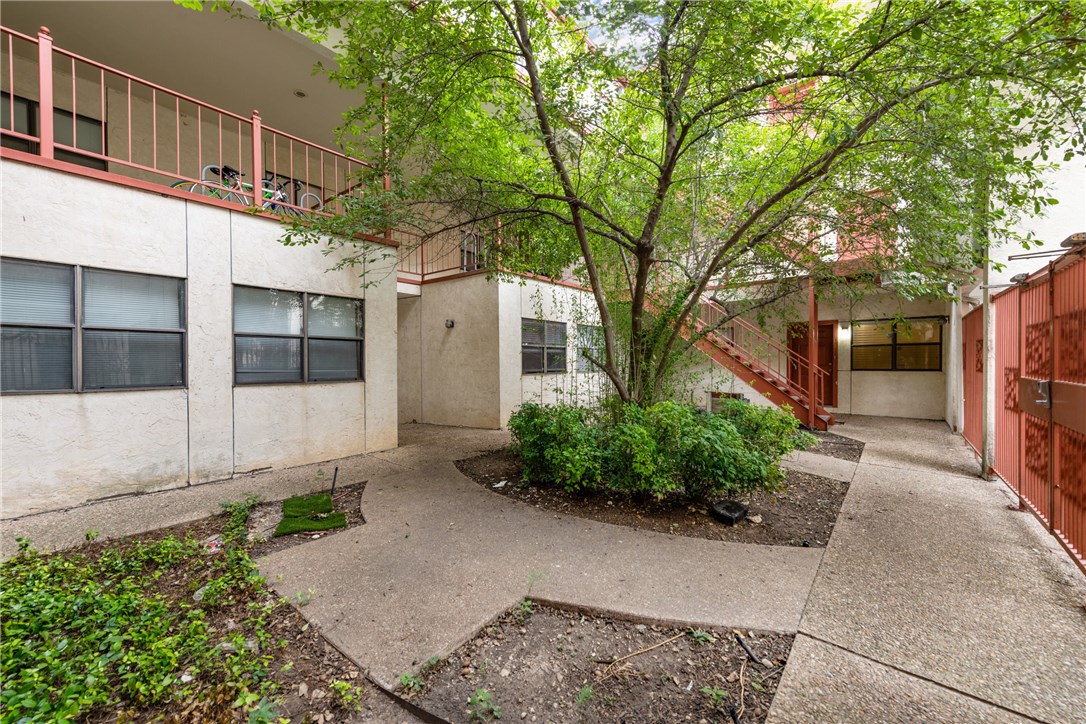 706 West 22nd Street, Unit 202 Austin, TX 78705 - Photo 23 of 24 a front view of a house with garden