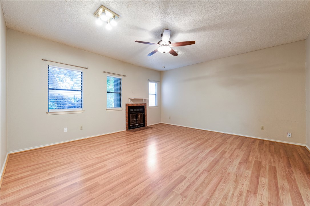 706 West 22nd Street, Unit 202 Austin, TX 78705 - Photo 4 of 24 wooden floor in an empty room with a window