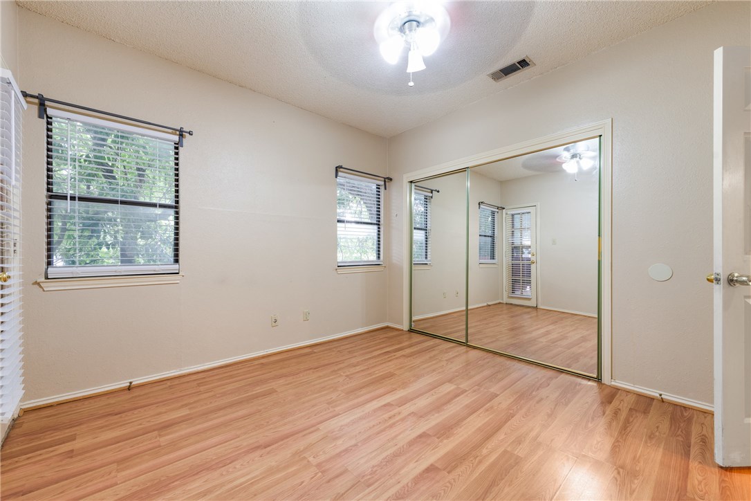 706 West 22nd Street, Unit 202 Austin, TX 78705 - Photo 7 of 24 a view of empty room with wooden floor and fan